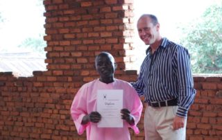 Criminon Rwanda Graduate with an instructor