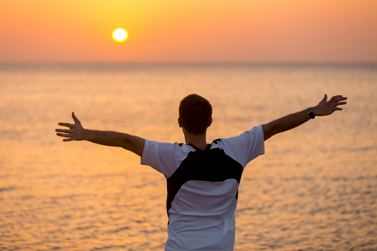 Young man enjoying sea and happiness