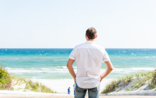 A man standing by the beach