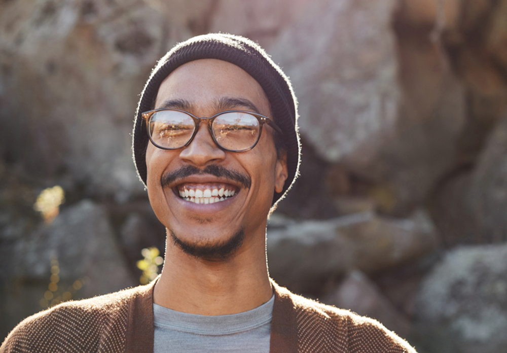 Young man smiling while enjoying a sunny day