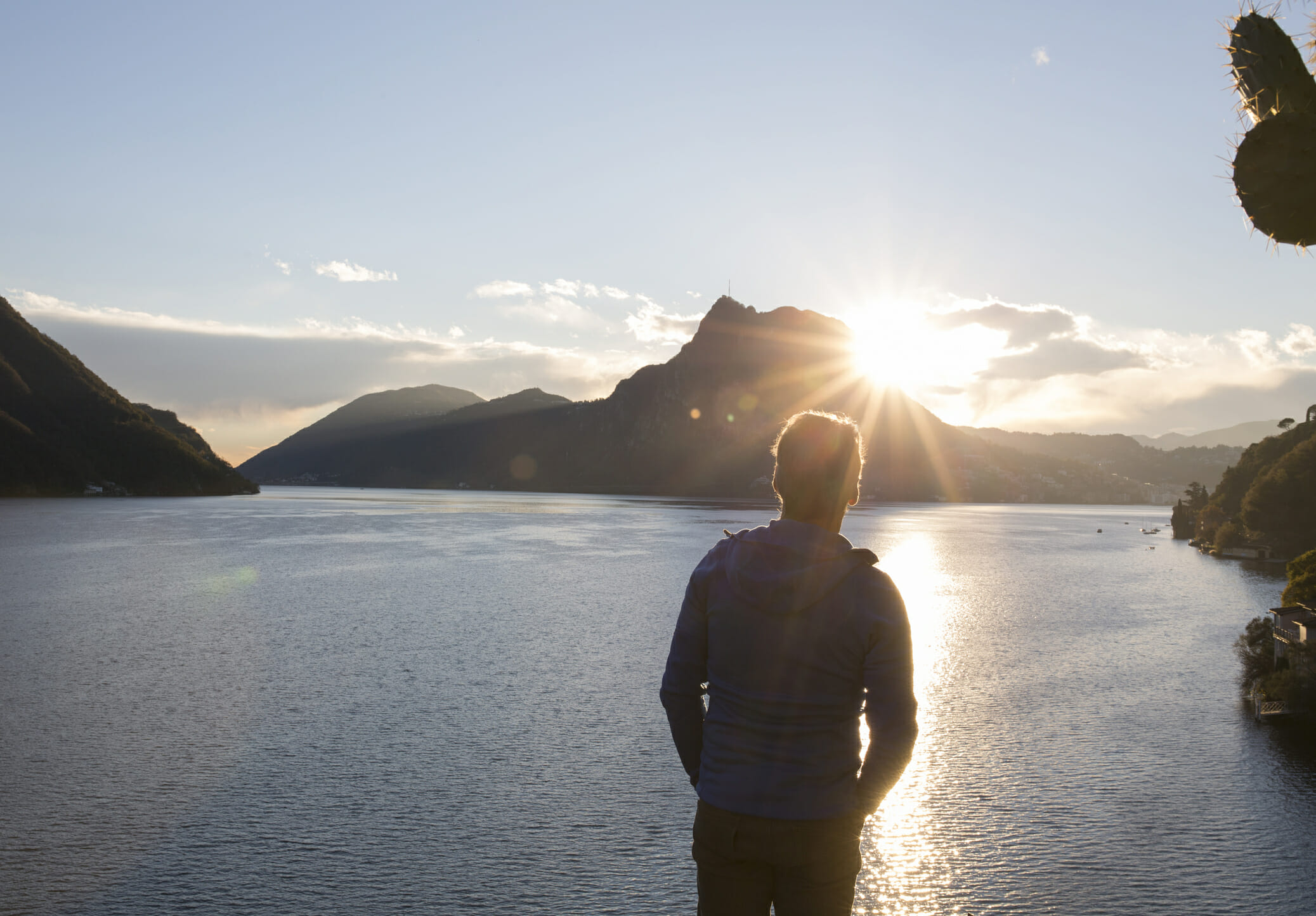 Man looks off to distant scene