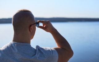 Muscle man is looking at the lake