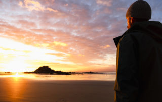 Man looking at the sunset.