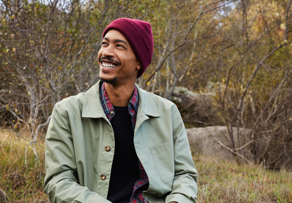 Young man smiling while enjoying a sunny day