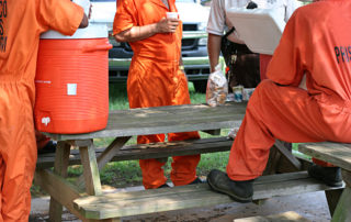 Inmates taking a break from community service work