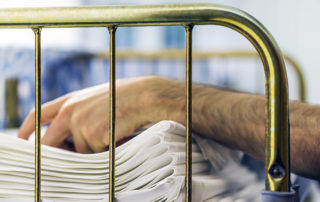 Man folds and stacks laundry