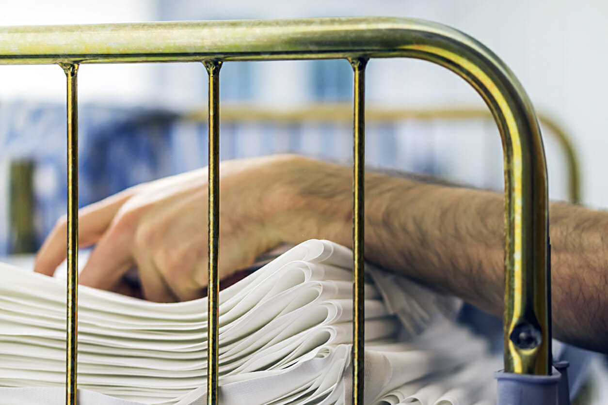 Man folds and stacks laundry