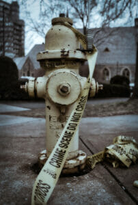 Hydrant draped with crime scene police tape