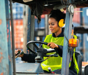Woman drives forklift