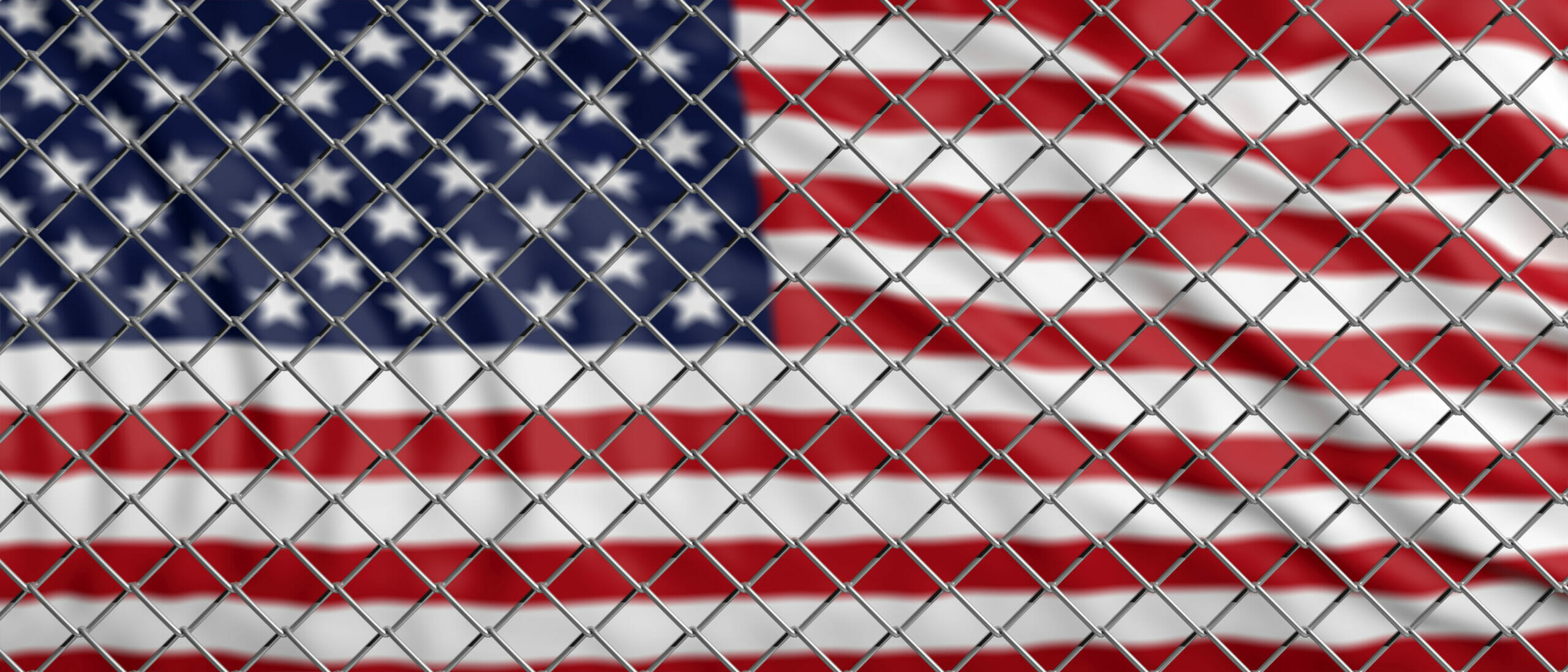 US flag behind fence