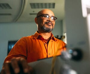 Happy man working on computer