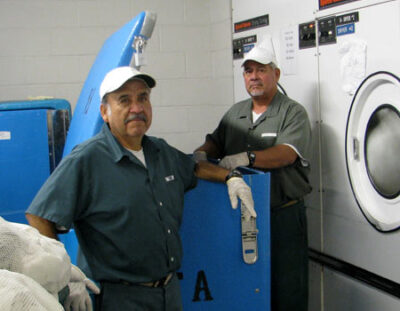 Inmates working in laundry.