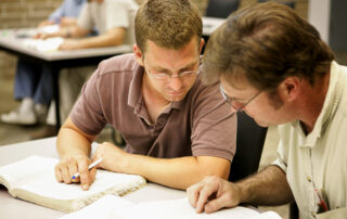 Adult men studying