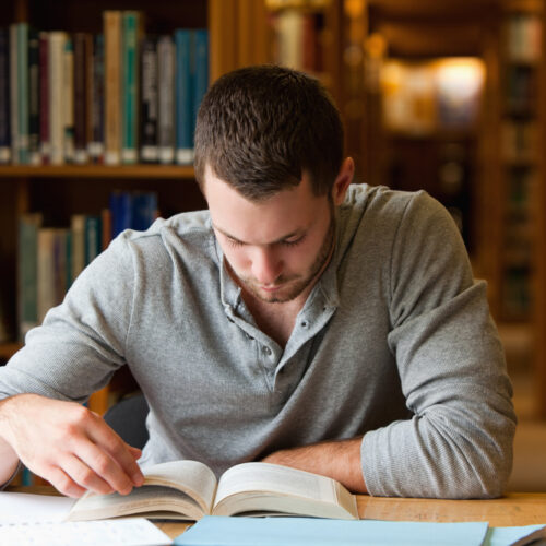 Man reads in a library