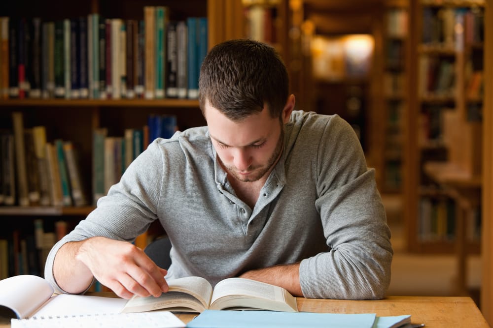 Man reads in a library