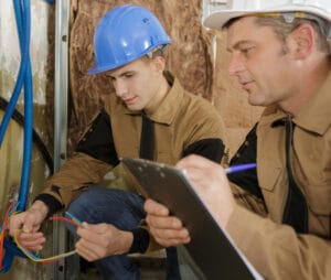Two men doing vocational training on construction